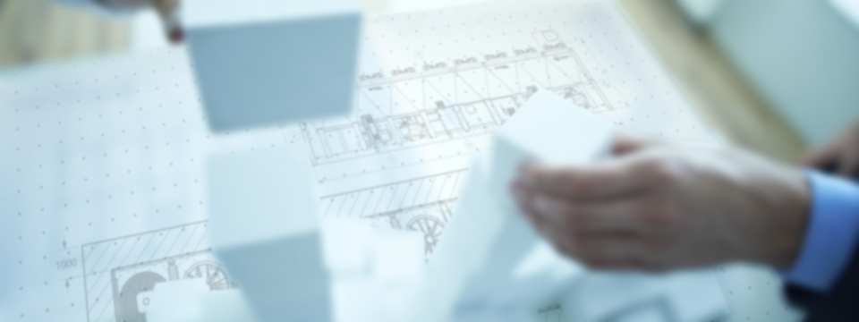 Close-up of human hands building a stack of blocks