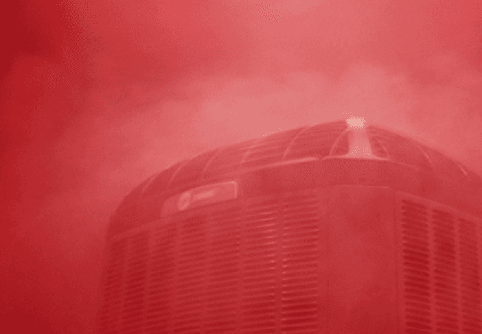 Trane heating unit is standing in a cloud of red steam.