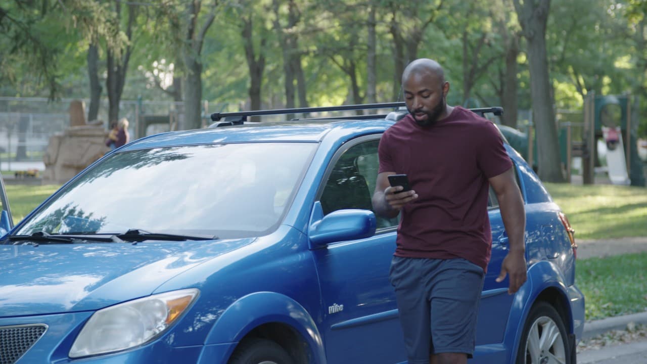 Man in front of car