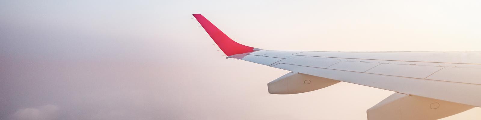 A red and white airplane wing.