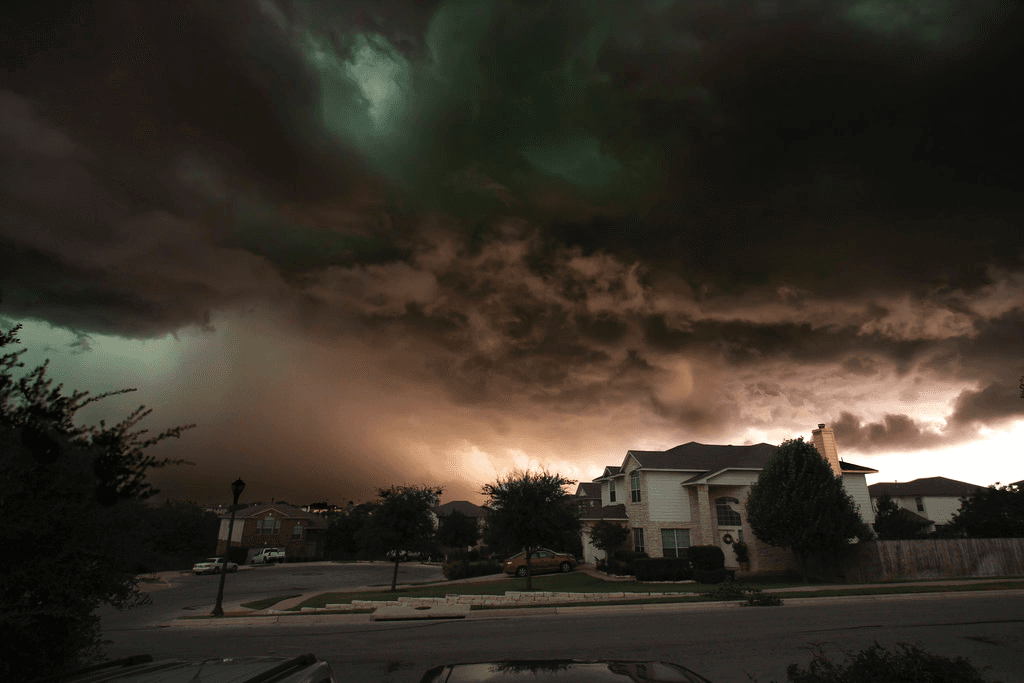 Ominous dark and stormy clouds form over a home.