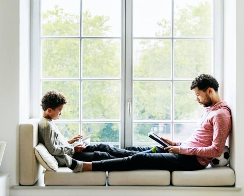 A father and son enjoy clean indoor air.