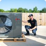 An HVAC technician installing an outdoor unit.