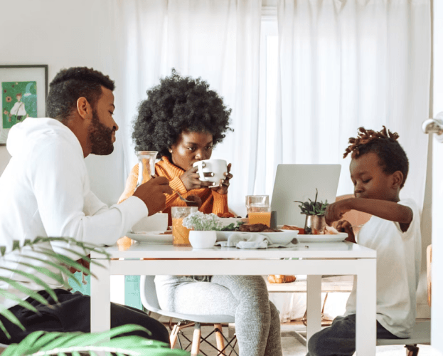 Young family at the kitchen table.
