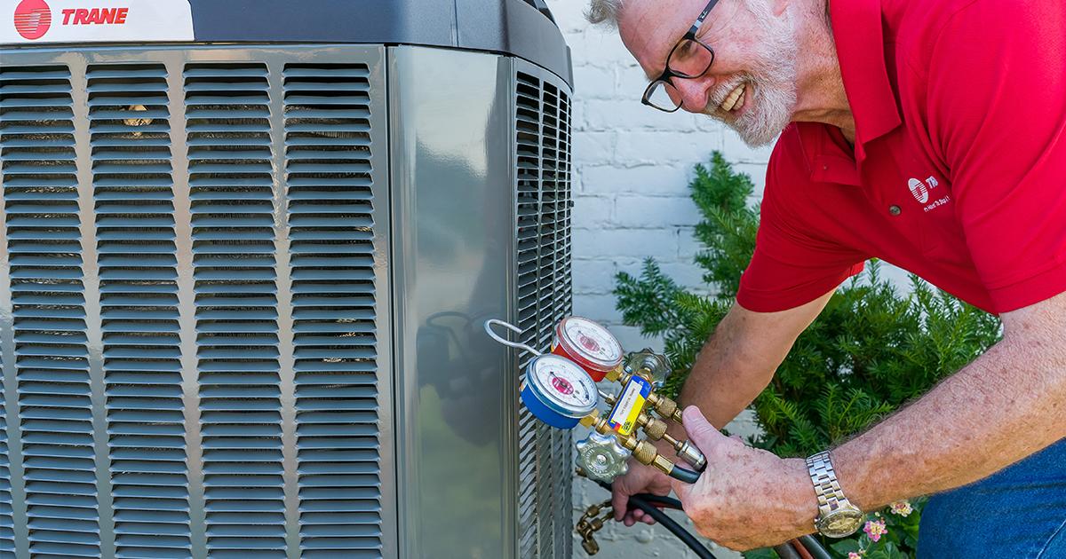 AC Repair Technician with Manifold Gauges