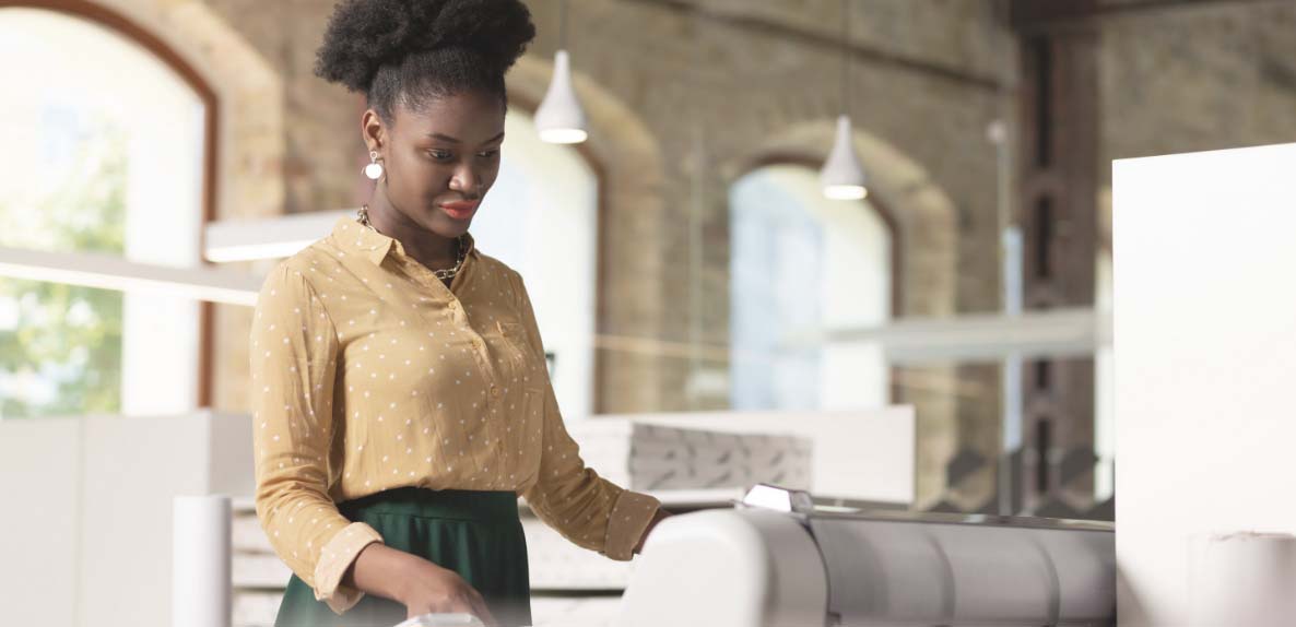 Woman Printing on a Plot Machine