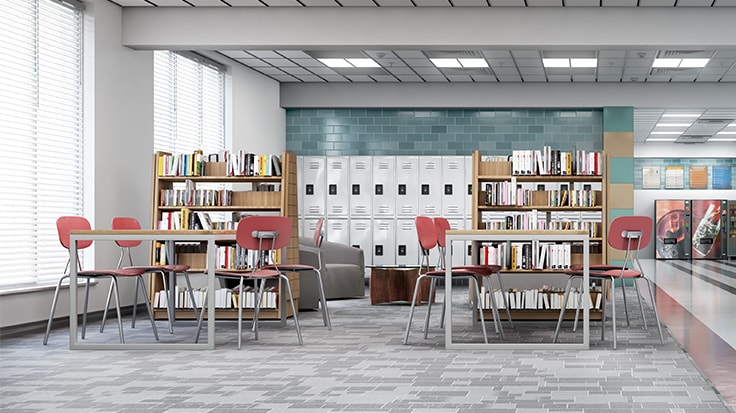 Interior view of a modern school building with lockers, tables and bookshelves