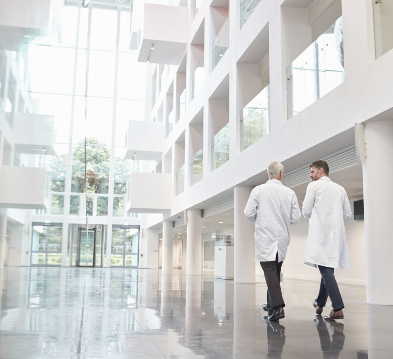 Doctor walking in white corridor