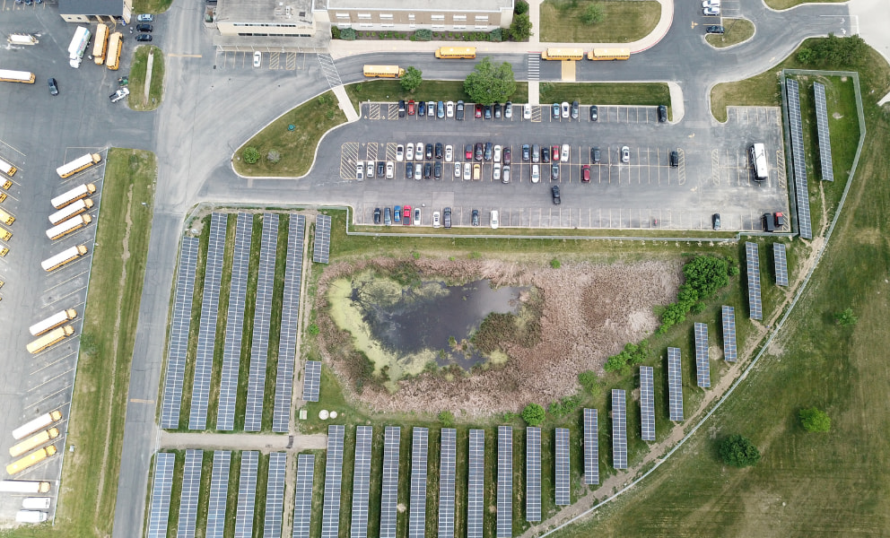 Birds eye view of solar panels and the school