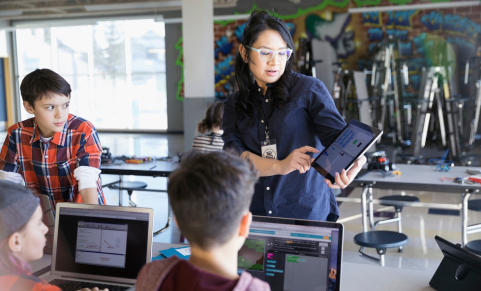 Teacher presenting to a small group