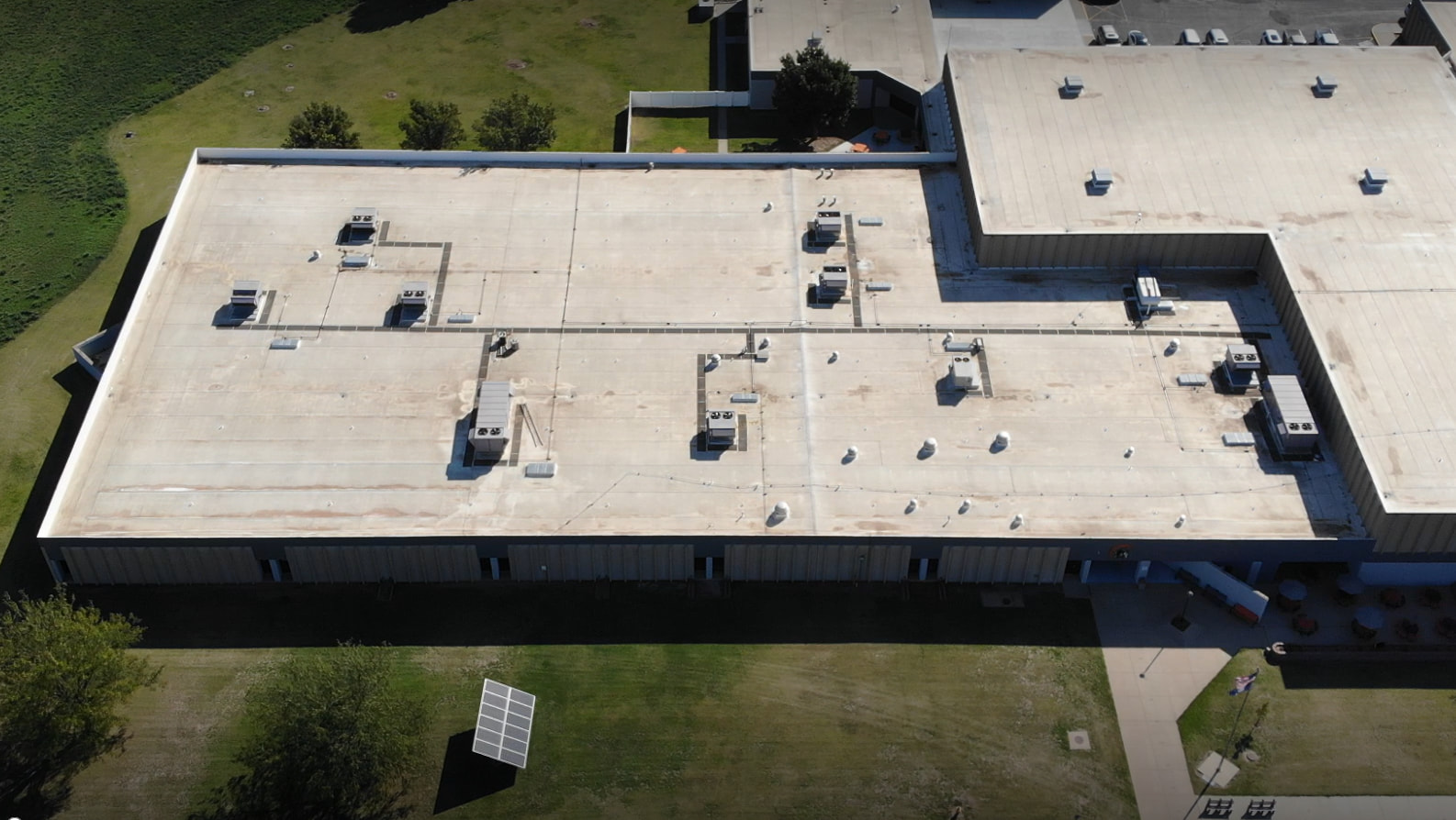 Rooftop view of high school with rooftop HVAC units