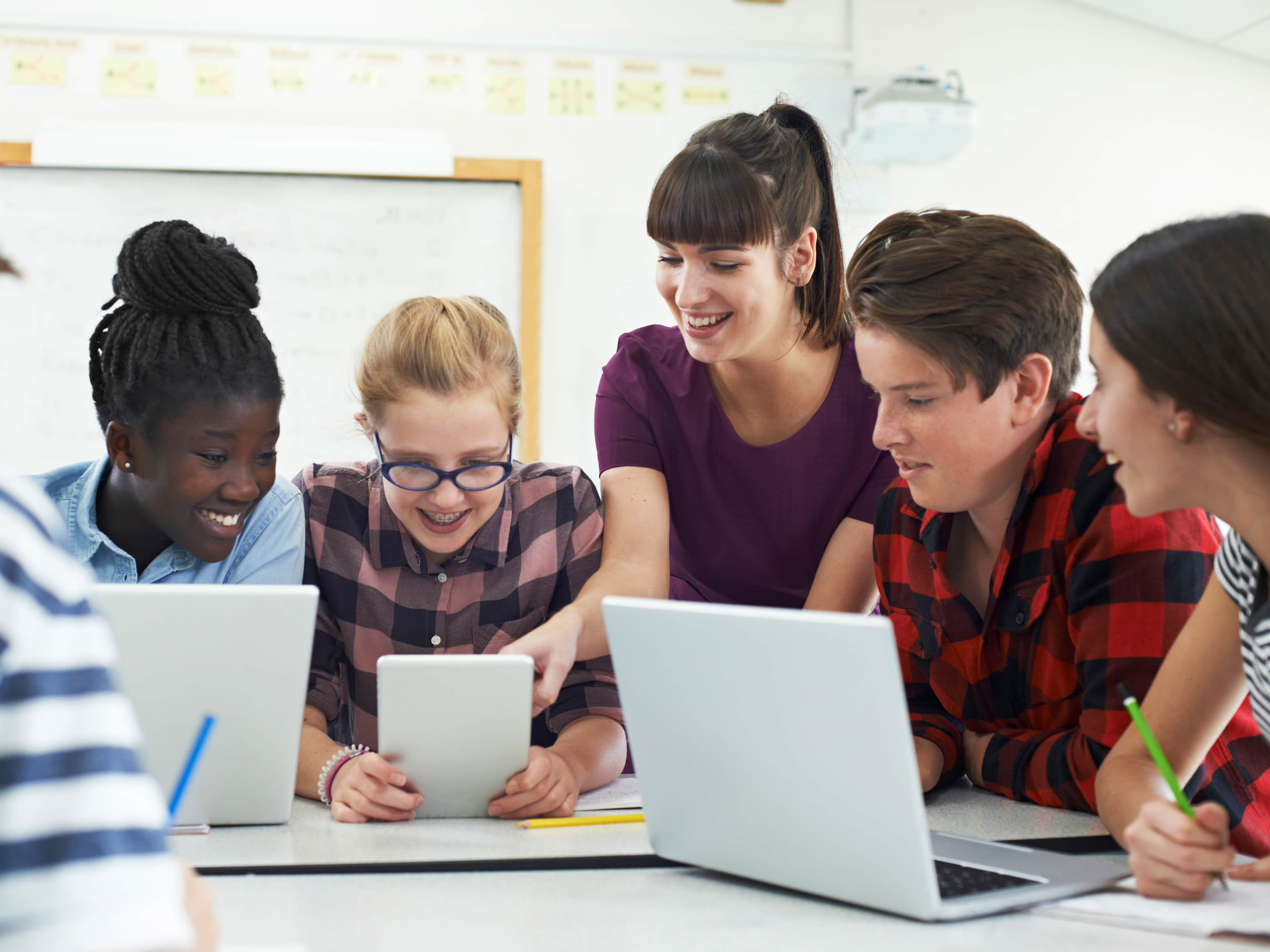 Students learning with tablets and laptops