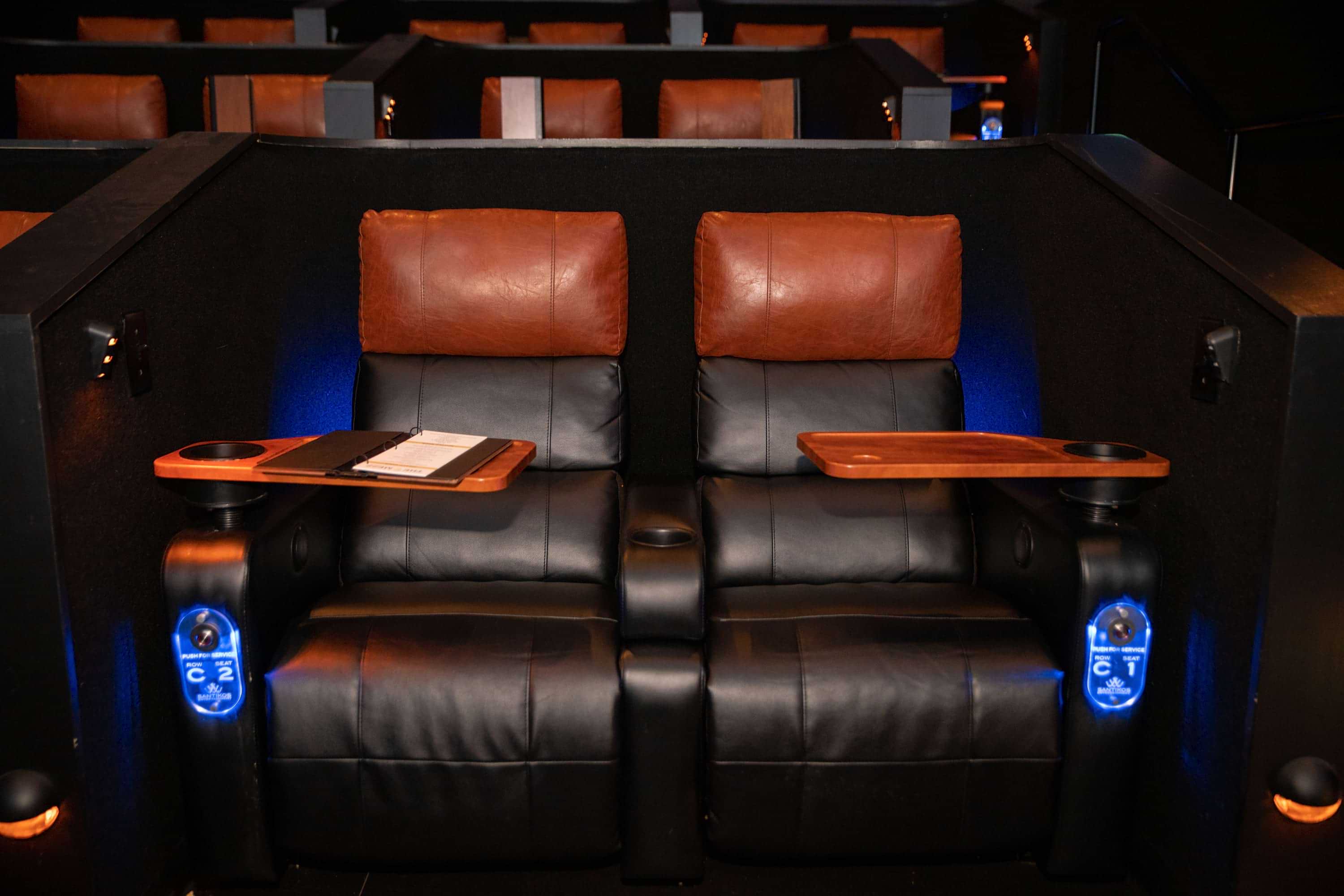 Santikos Theater leather seats with tables