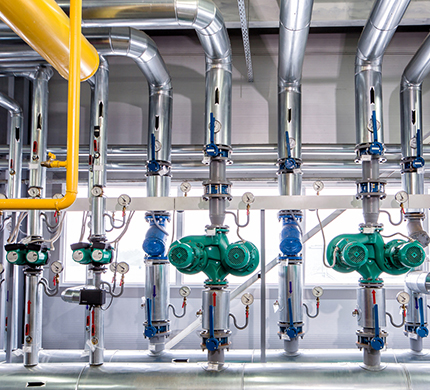 interior of an industrial boiler, the piping, pumps and motors