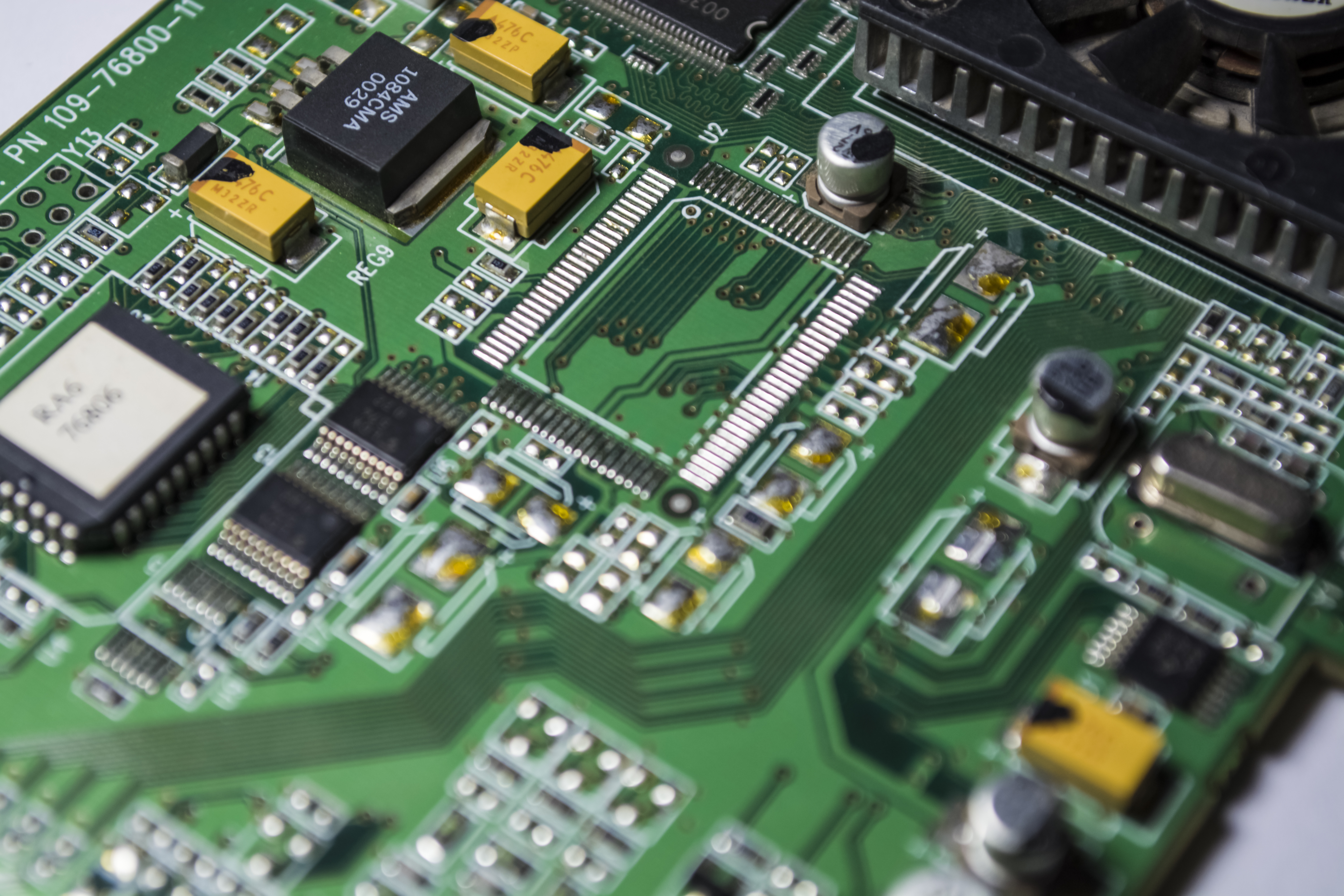 The motherboard of green color from the personal computer. Repair. Texture or background. Electronics. Spare parts.