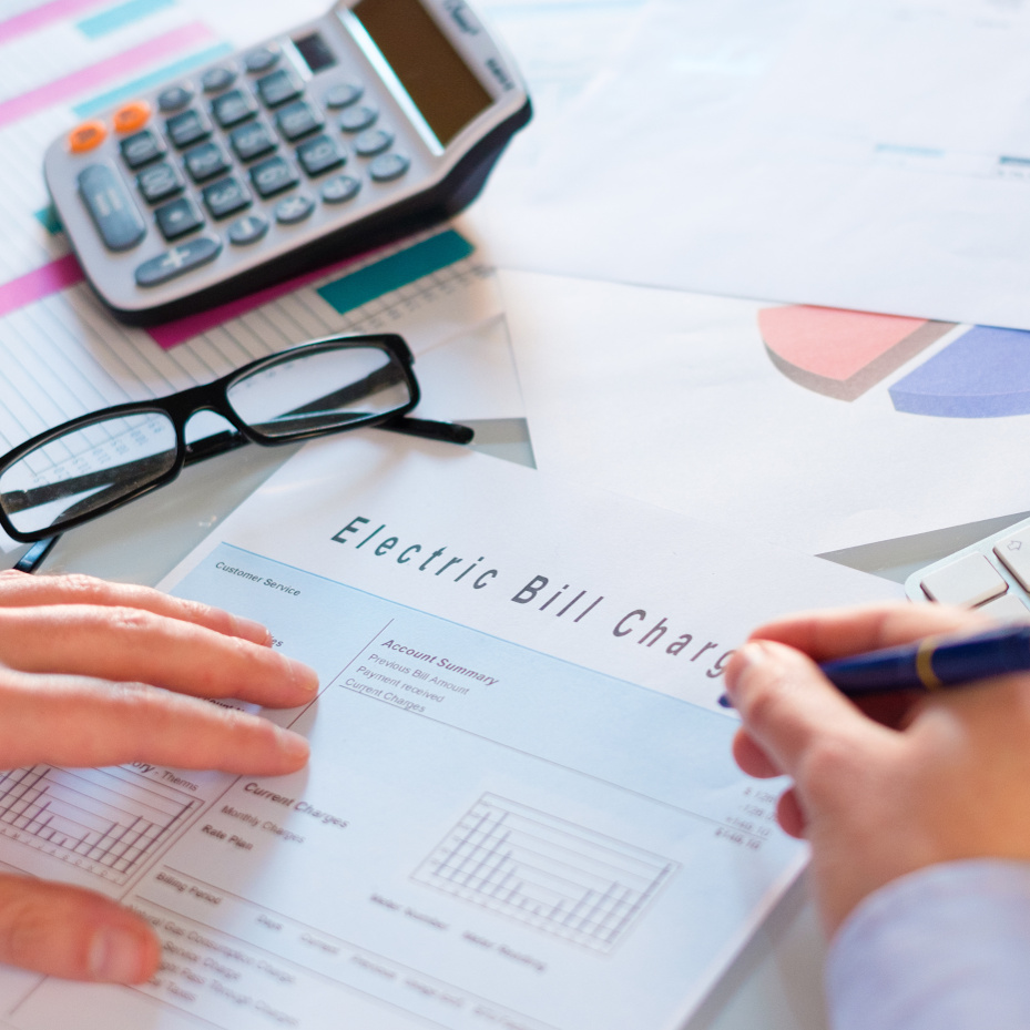 Close-up of businessperson analyzing accounting document at desk in office