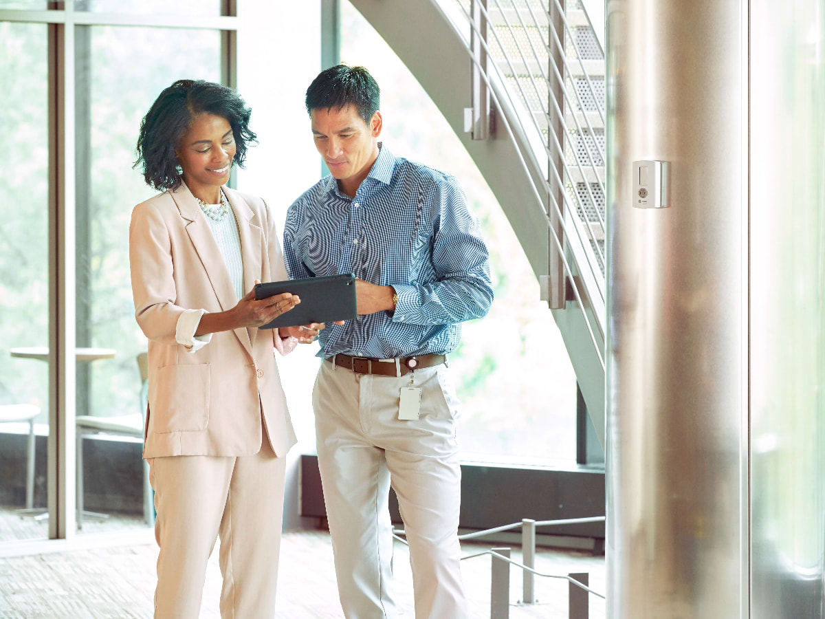 Business professionals standing in lobby