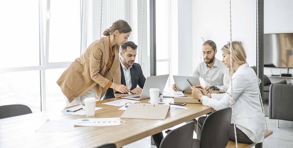 Colleagues working together in conference room