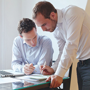 Businessmen discussing papers